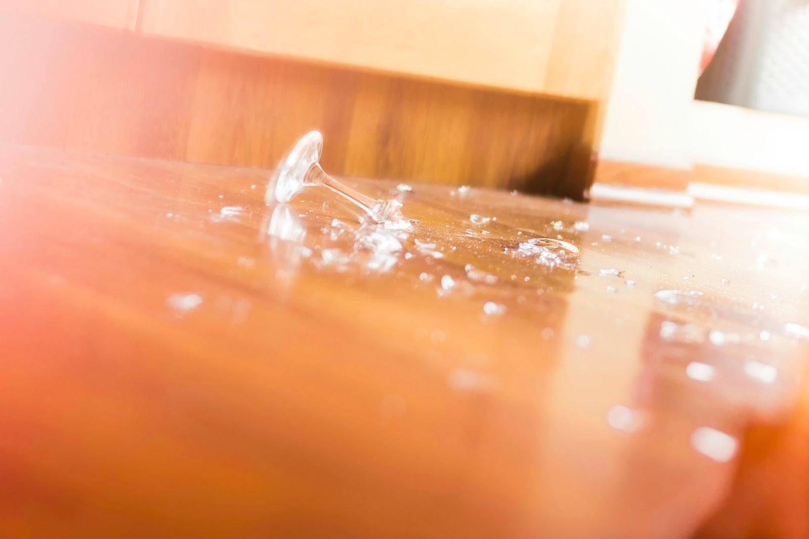 Water spreading across a wooden surface